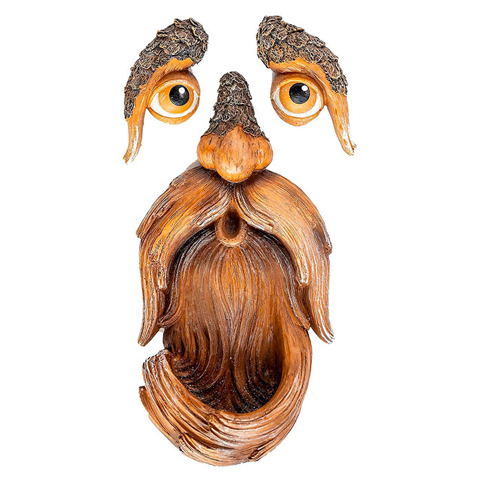 BirdFeeder, a tree decoration in the shape of a face that is also a bird feeder